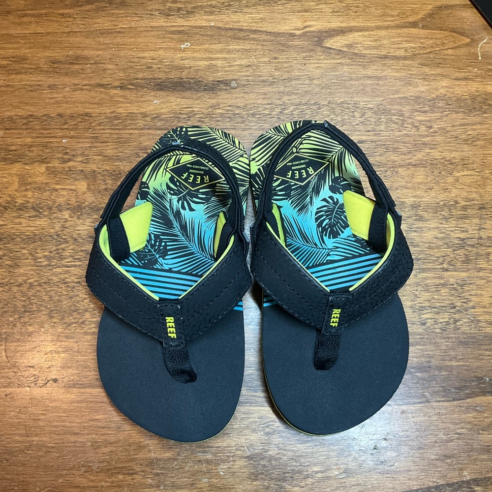 Reef Black and Yellow Tropical Flip Flops